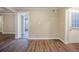 Simple dining area with wood-look flooring and access to other rooms at 2848 Baker Ridge Nw Dr, Atlanta, GA 30318
