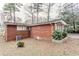 Brick house with side yard and landscaping at 2848 Baker Ridge Nw Dr, Atlanta, GA 30318