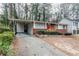 Brick ranch home with red door and carport at 2848 Baker Ridge Nw Dr, Atlanta, GA 30318