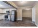 Kitchen features stainless steel appliances and wood-look flooring at 2848 Baker Ridge Nw Dr, Atlanta, GA 30318