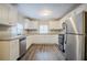 Modern kitchen with stainless steel appliances and granite countertops at 2848 Baker Ridge Nw Dr, Atlanta, GA 30318