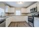 Updated kitchen featuring stainless steel appliances and granite countertops at 2848 Baker Ridge Nw Dr, Atlanta, GA 30318