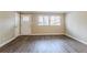 Spacious living room with hardwood floors and neutral walls at 2848 Baker Ridge Nw Dr, Atlanta, GA 30318
