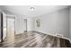 Bright bedroom with wood-look floors and ample closet space at 2131 Ben Hill Rd, Atlanta, GA 30344