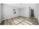 Charming bedroom with wood-look floors and access to another room at 2131 Ben Hill Rd, Atlanta, GA 30344