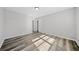 Spacious bedroom with wood-look floors and a large closet at 2131 Ben Hill Rd, Atlanta, GA 30344