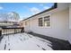 Wooden deck with partial snow cover, overlooks backyard at 2131 Ben Hill Rd, Atlanta, GA 30344