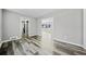 Open dining room with gray walls, wood-look flooring, and views to the kitchen at 2131 Ben Hill Rd, Atlanta, GA 30344