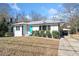 Charming updated home with a turquoise front door, showcasing curb appeal at 2131 Ben Hill Rd, Atlanta, GA 30344