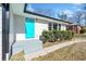 Inviting front entrance with a teal door and gray steps leading to the home at 2131 Ben Hill Rd, Atlanta, GA 30344