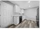 Modern kitchen with white cabinets, granite counters, and black appliances at 2131 Ben Hill Rd, Atlanta, GA 30344