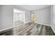 Bright living room with hardwood floors and access to other rooms at 2131 Ben Hill Rd, Atlanta, GA 30344