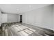 Open concept living area with gray walls and gray vinyl plank flooring at 2131 Ben Hill Rd, Atlanta, GA 30344