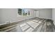 Spacious living room featuring gray walls, vinyl wood flooring, and large windows at 2131 Ben Hill Rd, Atlanta, GA 30344