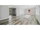 Open living area featuring gray walls, wood-look floors, and abundant natural light at 2131 Ben Hill Rd, Atlanta, GA 30344