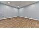 Spacious unfinished basement with light blue walls at 415 Royal Crescent E Ln, Canton, GA 30115