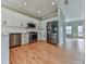 Modern kitchen with stainless steel appliances and hardwood floors at 415 Royal Crescent E Ln, Canton, GA 30115