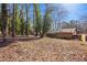 Large backyard with mature trees and open space at 3441 Creekwood Drive Southeast, Conyers, GA 30094