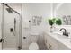 Modern bathroom with a walk-in shower and white vanity at 1167 Key Se Rd, Atlanta, GA 30316