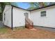 Rear exterior view of the house with gray door at 1167 Key Se Rd, Atlanta, GA 30316