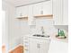 Modern white kitchen with quartz countertops and new sink fixtures at 2905 Gresham Se Rd, Atlanta, GA 30316