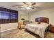 Main bedroom with ceiling fan and wood-look floors at 4162 Samuel Ct, Norcross, GA 30093