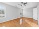 Bright bedroom with hardwood floors and ceiling fan at 805 Abbotts Mill Ct # 74, Duluth, GA 30097