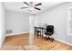 Bright bedroom with hardwood floors, a ceiling fan and an ensuite bathroom at 805 Abbotts Mill Ct # 74, Duluth, GA 30097