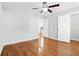 Spacious bedroom with hardwood floors and ceiling fan at 805 Abbotts Mill Ct # 74, Duluth, GA 30097