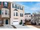 Attractive tan townhome, two-story with a deck and green door at 805 Abbotts Mill Ct # 74, Duluth, GA 30097