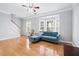 Living room featuring hardwood floors, fireplace, and bay window at 805 Abbotts Mill Ct # 74, Duluth, GA 30097