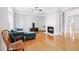 Bright living room with hardwood floors and a fireplace at 805 Abbotts Mill Ct # 74, Duluth, GA 30097