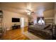 Main bedroom with hardwood floors and a sitting area at 1053 Fairway Valley Dr, Woodstock, GA 30189