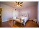 Well-lit bedroom with hardwood floors and ceiling fan at 1053 Fairway Valley Dr, Woodstock, GA 30189