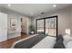 Main bedroom with wood floors, sliding doors, and ensuite laundry at 1536 Bullard Rd, Powder Springs, GA 30127