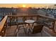 Cozy balcony with wooden railing, string lights, and outdoor seating, perfect for enjoying sunset views at 1720 Habersham Villa Dr, Cumming, GA 30041