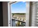 Beautiful balcony view showcasing a neighborhood and natural greenery beyond at 1720 Habersham Villa Dr, Cumming, GA 30041