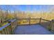 Wooden deck overlooking a wooded area at 256 Kings Cv, Locust Grove, GA 30248