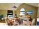 Living room with hardwood floors, fireplace, and staged furniture at 256 Kings Cv, Locust Grove, GA 30248