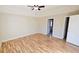 Large main bedroom with hardwood floors and ceiling fan at 256 Kings Cv, Locust Grove, GA 30248