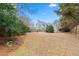 Large backyard with fire pit and mature trees at 3523 Weaver Falls Ln, Loganville, GA 30052