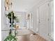 Bright foyer with hardwood floors, glass-top console table, and white door at 3523 Weaver Falls Ln, Loganville, GA 30052