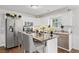 Kitchen with stainless steel appliances and an island at 3523 Weaver Falls Ln, Loganville, GA 30052