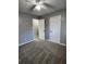 Spacious bedroom with grey walls, grey carpet, and double closets at 212 Valerie Cir, Hiram, GA 30141