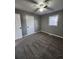 Bedroom with grey walls, grey carpet, and ample closet space at 212 Valerie Cir, Hiram, GA 30141