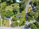 Aerial view showing a ranch house on a large lot with surrounding trees at 3971 S Hurt Rd, Smyrna, GA 30082