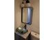 Bathroom features an eye-catching glass sink and a modern mirror with contemporary lighting at 1988 Glenmar Dr, Decatur, GA 30032