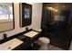 Modern bathroom featuring dual sinks, black marble and a glass-enclosed shower at 1988 Glenmar Dr, Decatur, GA 30032