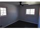 This bedroom offers wood flooring, and lots of natural light from its dual windows at 1988 Glenmar Dr, Decatur, GA 30032