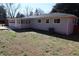 The backyard shows a light gray house with white trim, complemented by a well-maintained lawn at 1988 Glenmar Dr, Decatur, GA 30032